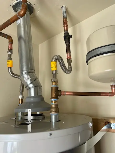 Water heater installation and plumbing repair in Woodvista
